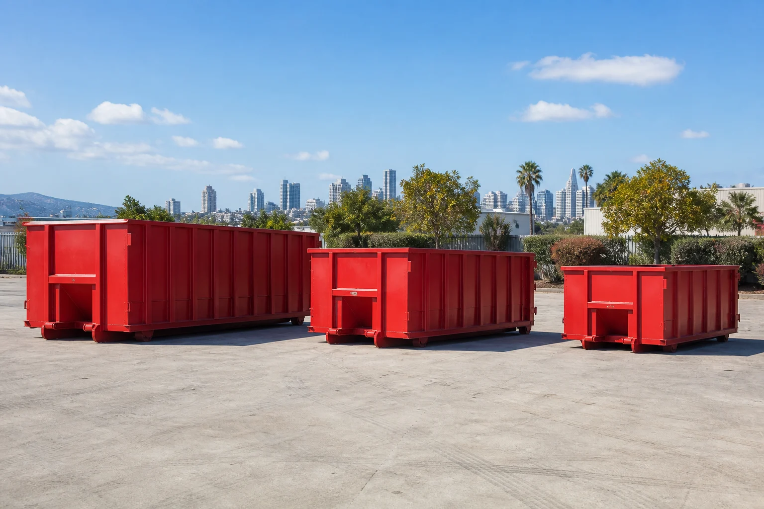 Red roll-off dumpsters in multiple sizes for comparing San Diego container starting rates